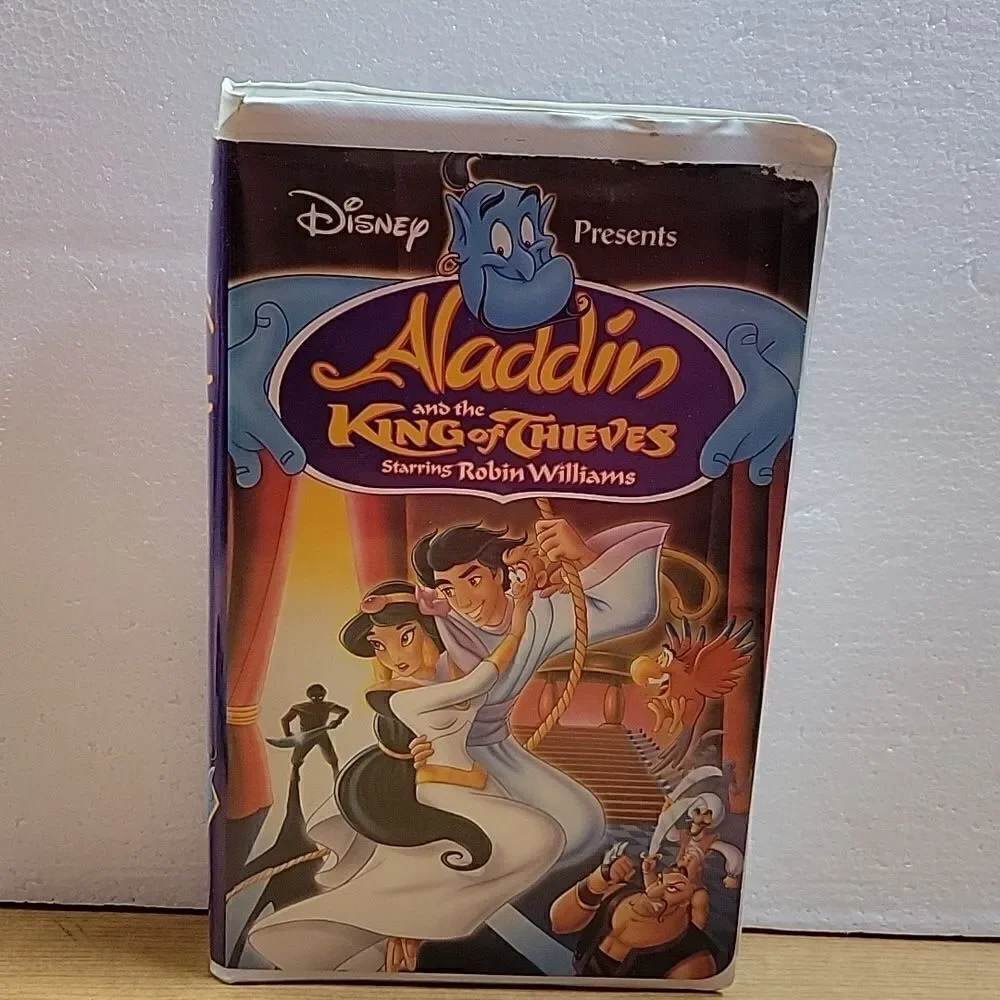 Disney Aladdin and Jafar VHS movies, book and puzzle and figures‎